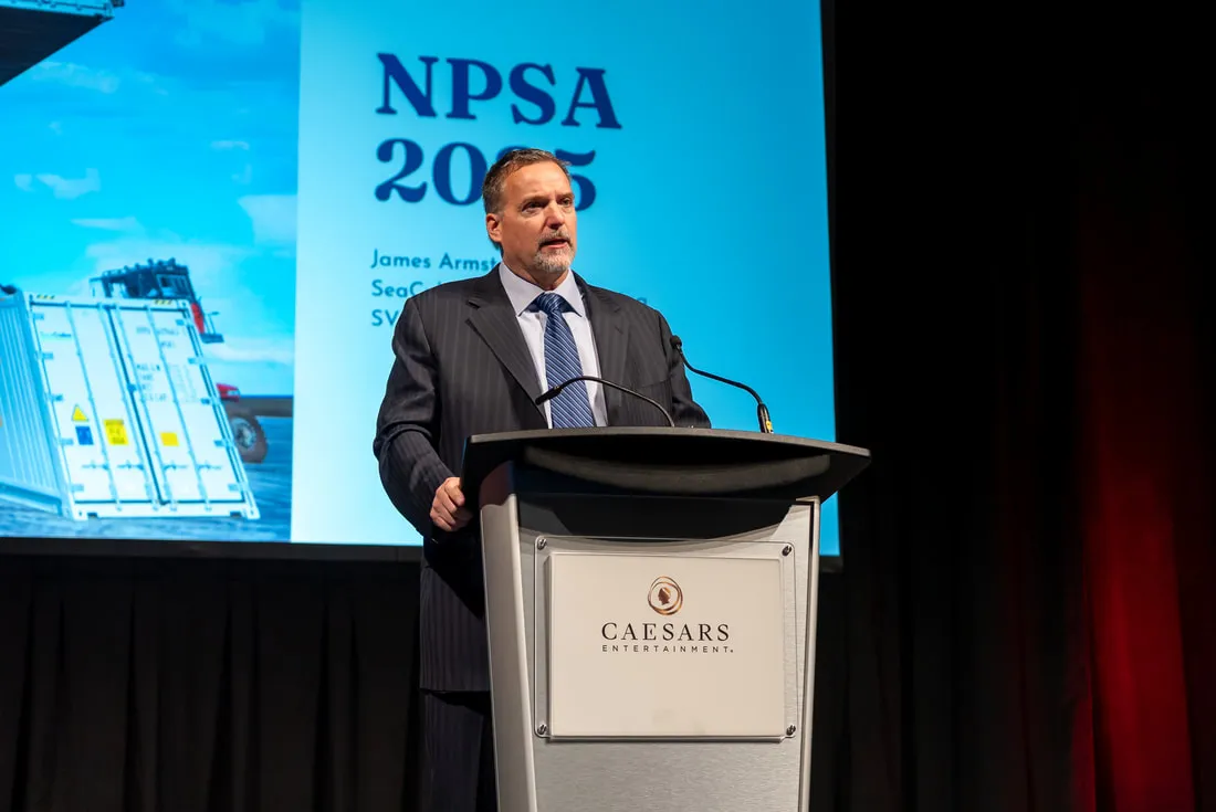 A speaker at the podium on the main stage of an NPSA conference